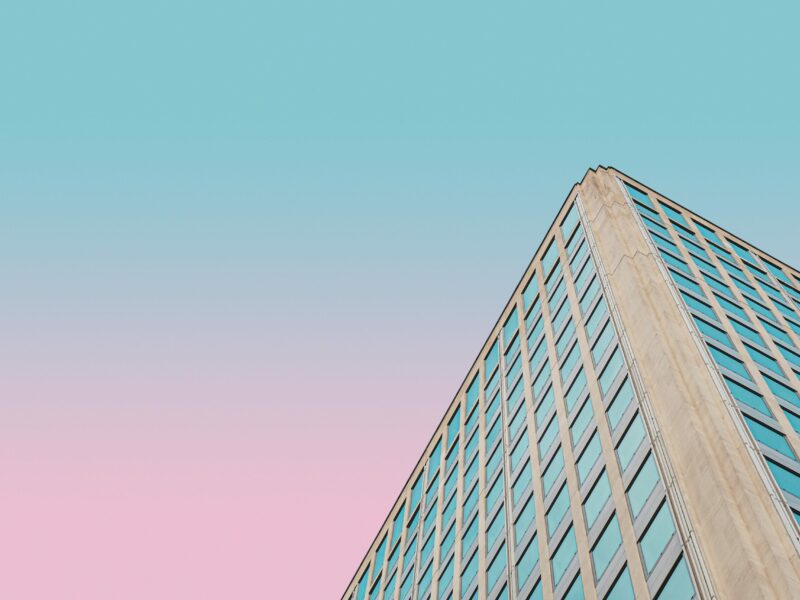 Skyscraper against a pink and blue sky